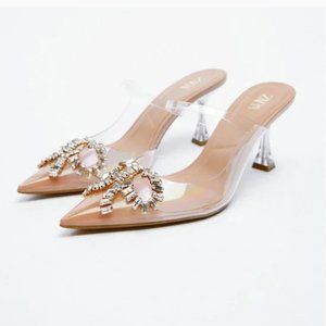 Shimmery Heeled Vinyl Mules with Sparkly Bow Details